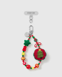 Handmade festive tree bead phone strap by STICKYZOO with silver-tone engraved hardware, shown with the Phone Strap Card