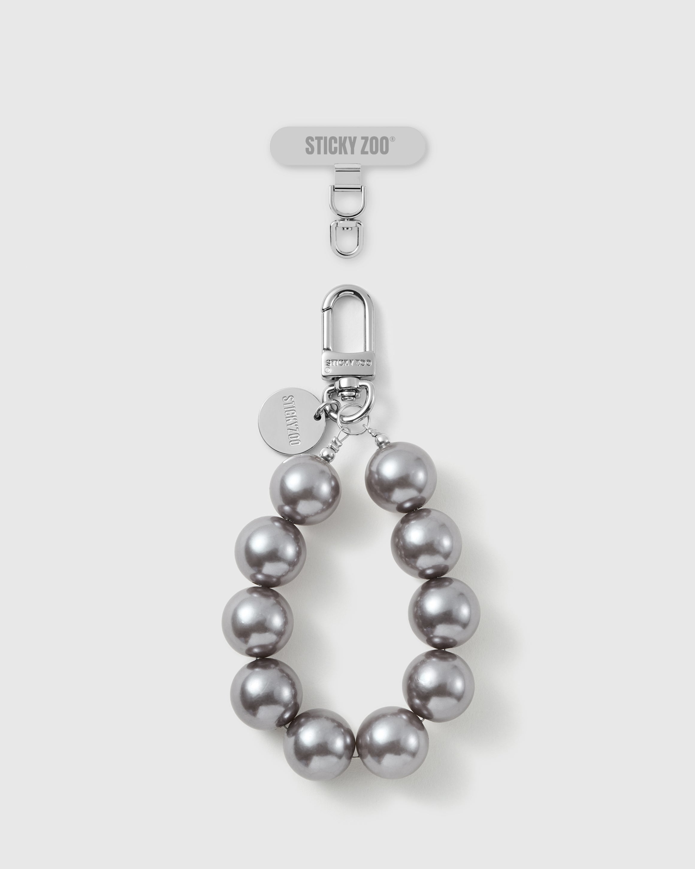 Handmade grey pearl-style beaded phone strap by STICKYZOO with silver-tone engraved hardware