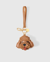 Close-up of handmade Poodle leather bag charm — hand-layered droopy ears in French Alran goatskin. STICKYZOO.
