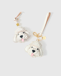 Poodle leather bag charm shown in both attachment options — handmade French Alran goatskin, dual attachment for bags or keys. STICKYZOO Amsterdam design.