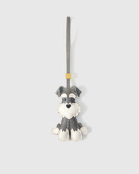 Gray Urban Schnauzer charm handmade from French Alran genuine goatskin and French suede — real full-grain leather from Tarn, since 1903. 3 days of hand-cutting, hand-stitching, hand-layering. Arrives in luxury gift packaging. Designed in Amsterdam.