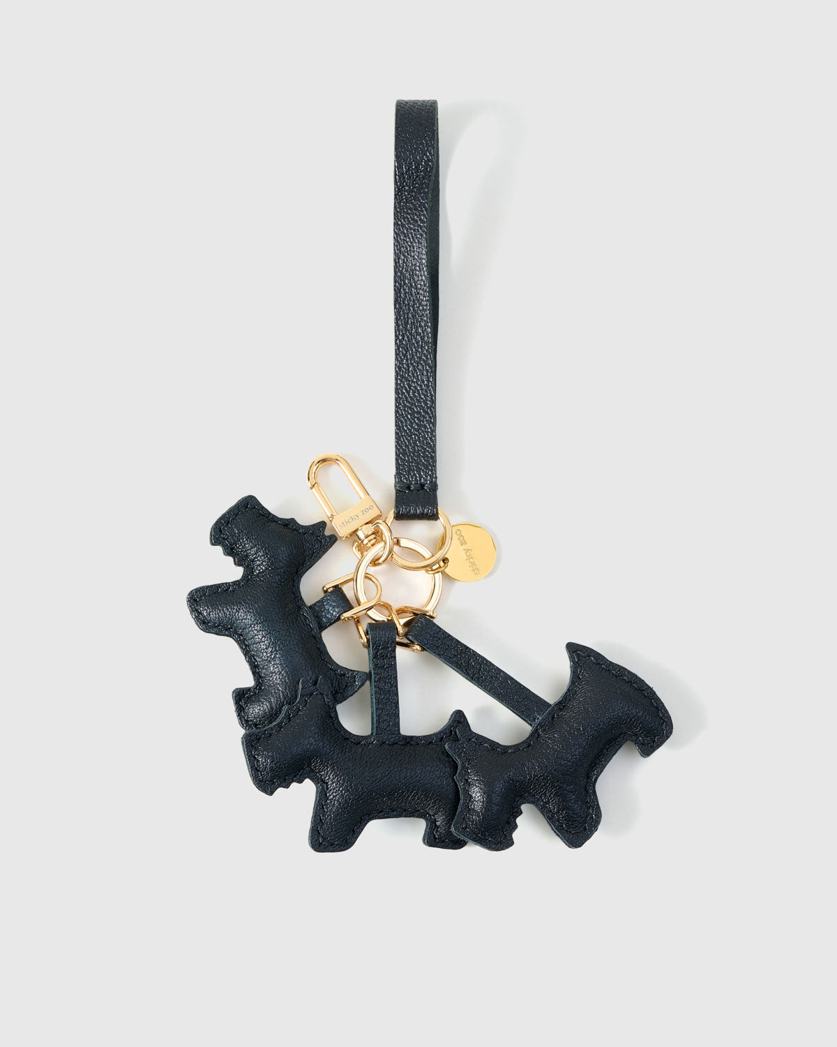 Real leather has memory. The more the triple schnauzer charm is carried, the more it deepens. The gift gets better with age.