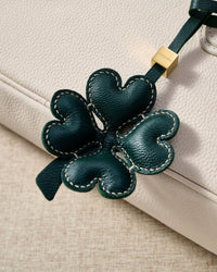 STICKYZOO Lucky Clover Charm in forest green padded 3D — handmade French Alran goatskin with 18K gold-plated hardware. Arrives gift-ready.