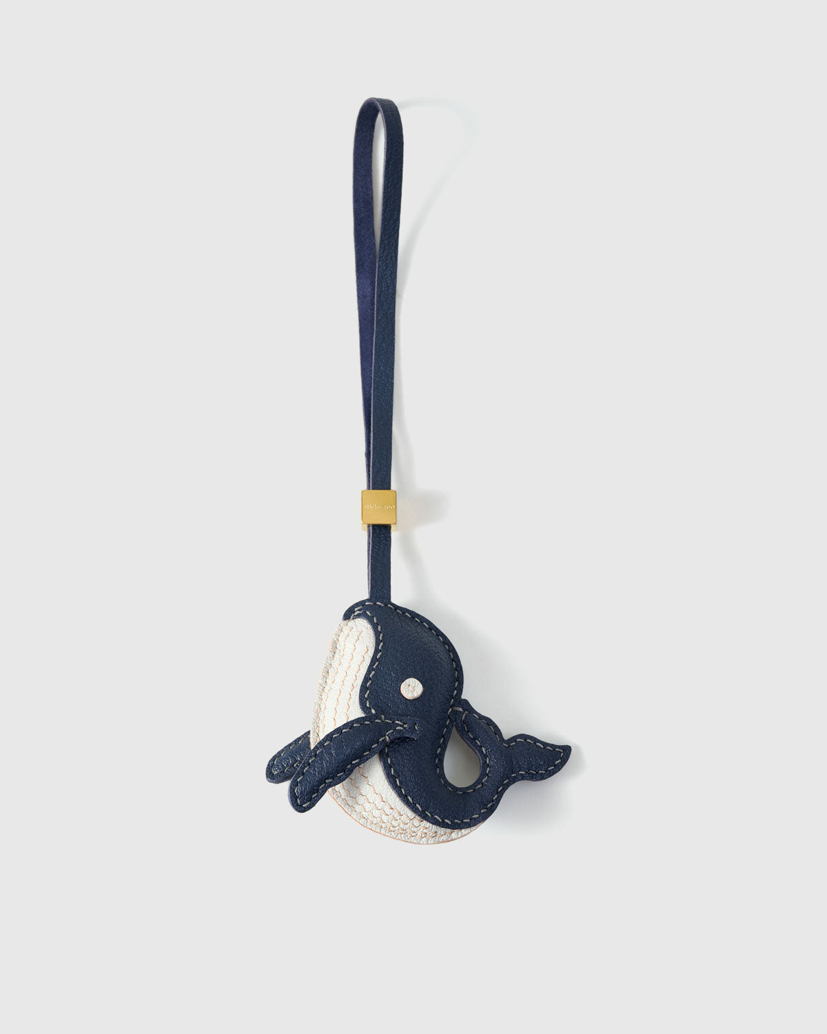 CATACEA charm handmade from French Alran goatskin and French suede — real full-grain French leather from Tarn, since 1903. Three days of hand-cutting, hand-stitching, hand-layering. Arrives in luxury gift packaging. Designed in Amsterdam.