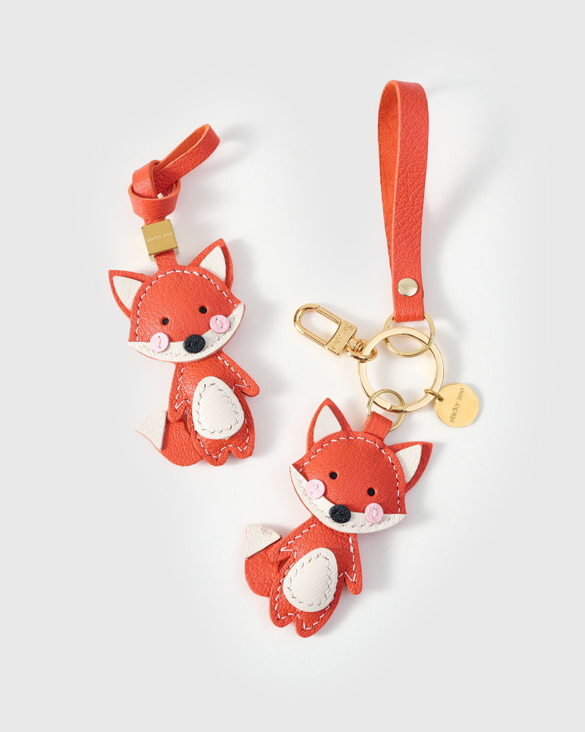 FOX CHARM on an 18K gold-plated keychain clip with engraved STICKYZOO disc — clips to keys, bags or backpacks.