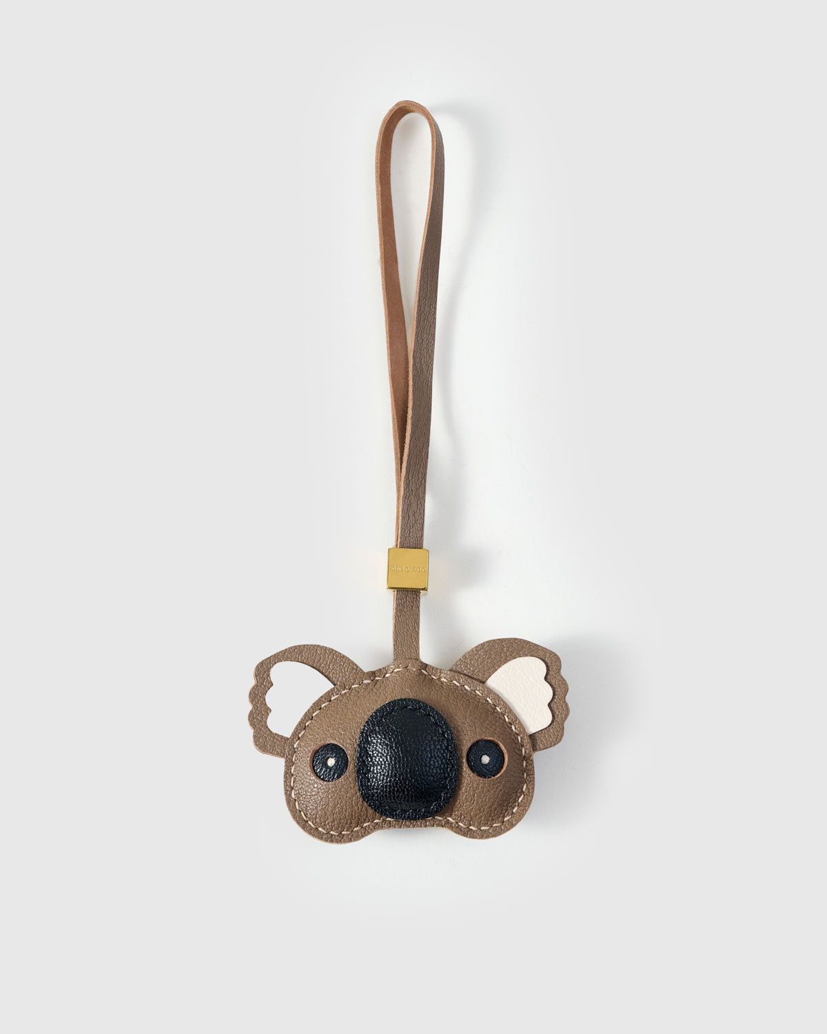 KOALA CHARM charm handmade from French Alran genuine goatskin — A koala face with a big dark nose and wide ears. Warm taupe. Three days by hand. Arrives in luxury gift packaging. Designed in Amsterdam.