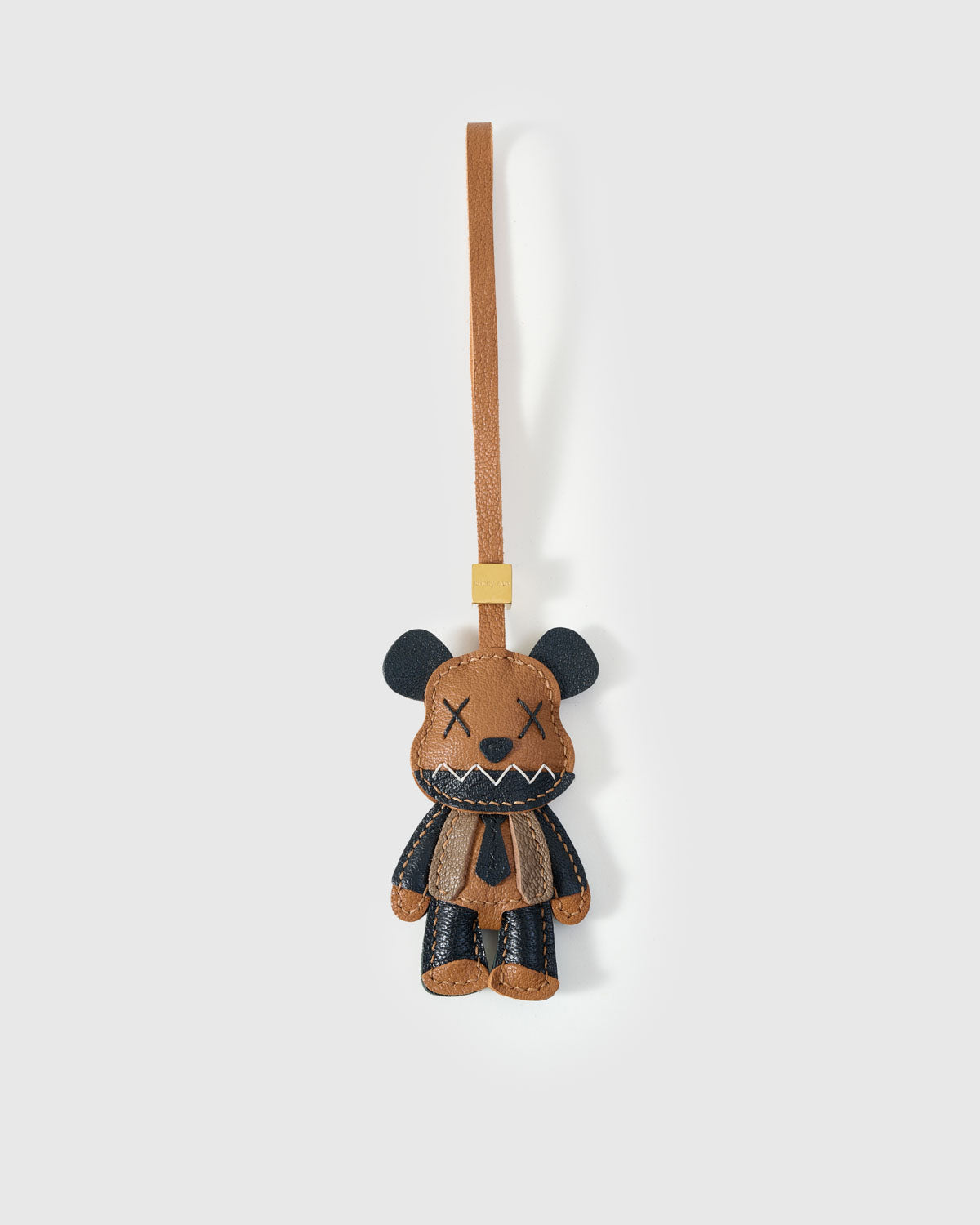 VIOLENT BEAR CHARM charm handmade from French Alran genuine goatskin — X eyes. Zigzag teeth. A leather tie. This bear did not come. Three days by hand. Arrives in luxury gift packaging. Designed in Amsterdam.