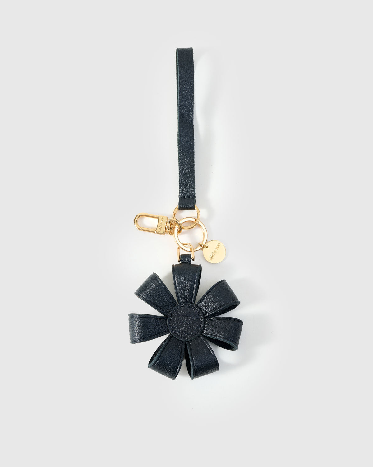 STICKYZOO Daisy Bag Charm in warm taupe — handmade French Alran goatskin, hand-cut and hand-stitched over 3 days.
