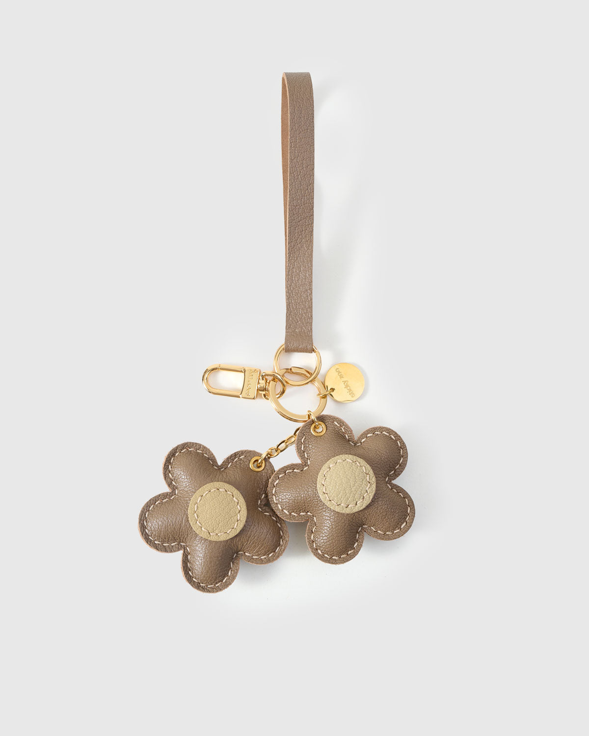 STICKYZOO Twin Flowers Charm — taupe French Alran goatskin petals with olive centres, gold keychain clip and engraved coin tag. 3-day handmade piece.
