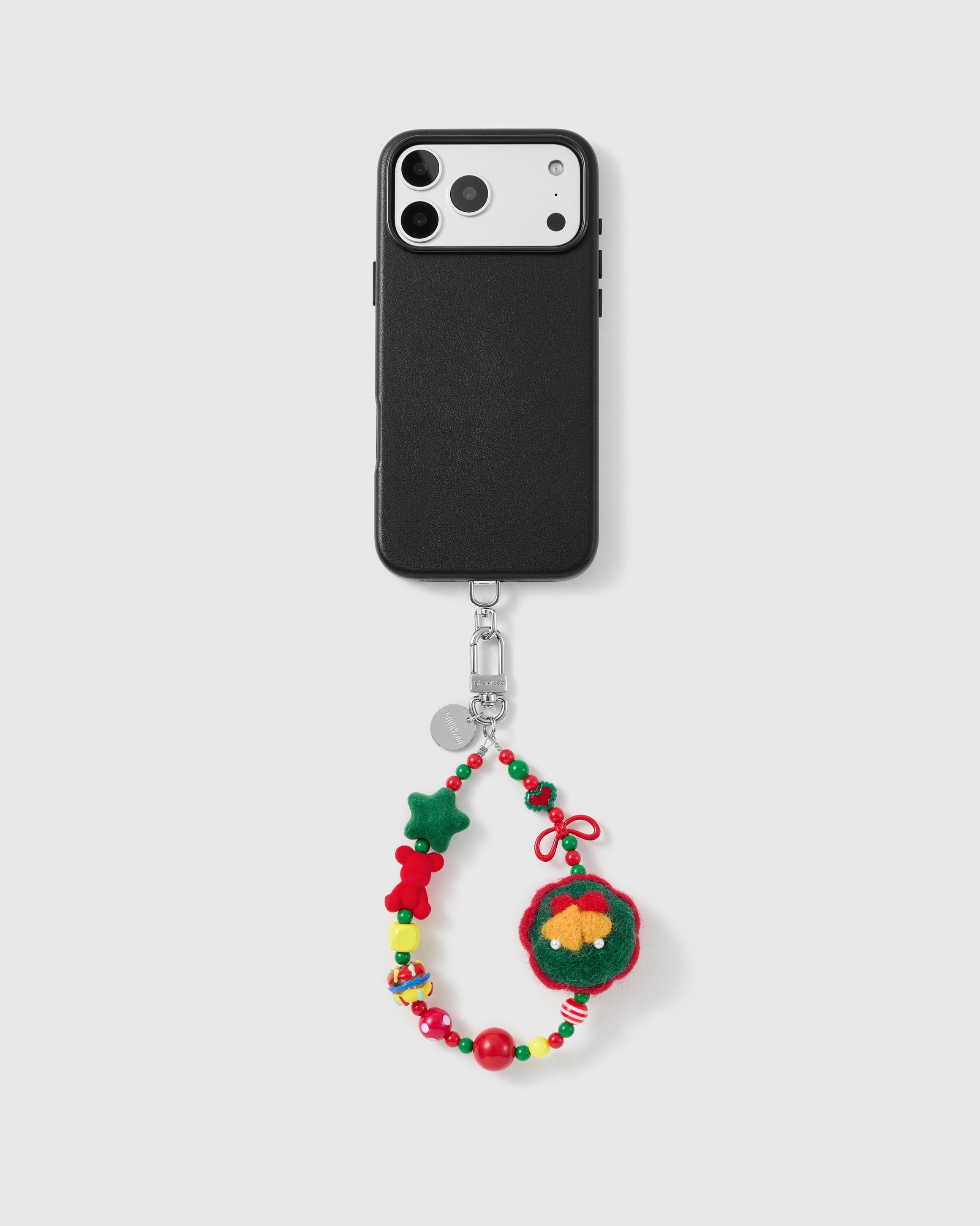 Handmade beaded phone strap on a black case, rated 4.9 across 5,000+ reviews