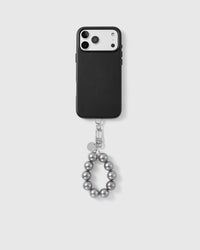 Handmade beaded phone strap on a black case, rated 4.9 across 5,000+ reviews