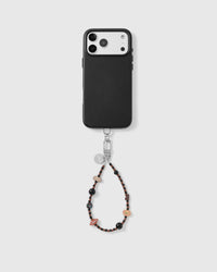 Handmade beaded phone strap on a black case, rated 4.9 across 5,000+ reviews