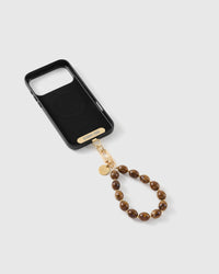 Amber swirl bead strap attached to a phone case with the included Phone Strap Card