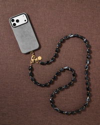 NOIR ORBIT CROSS-BODY PHONE STRAP