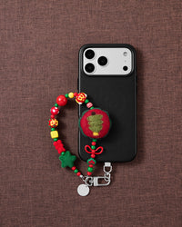 Christmas Tree phone strap styled on fabric, loved by thousands of STICKYZOO customers
