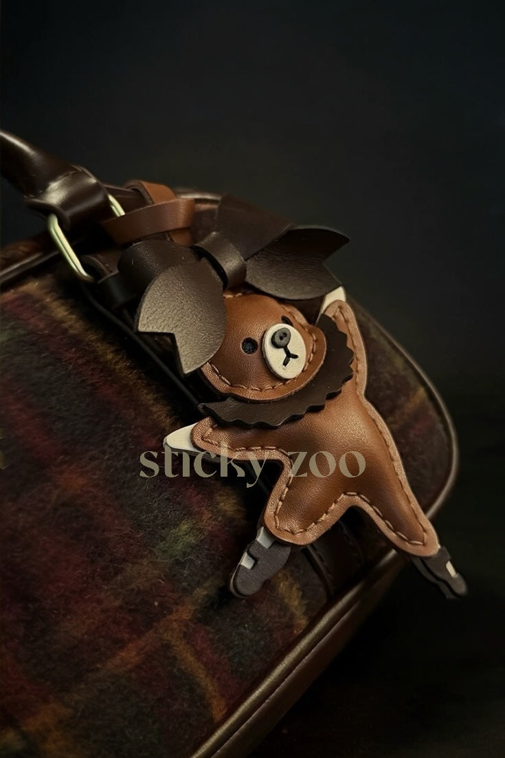 BALLET BEAR CHARM charm styled on a bag — a small, specific piece that turns a simple bag into a personal one.